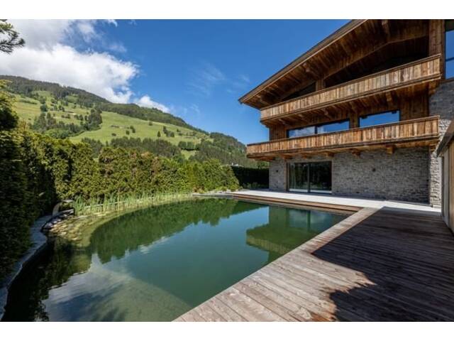Immobilie in Aurach bei Kitzbühel - High Class Erdgeschosswohnung mit eigenem Schwimmteich - Bild 1