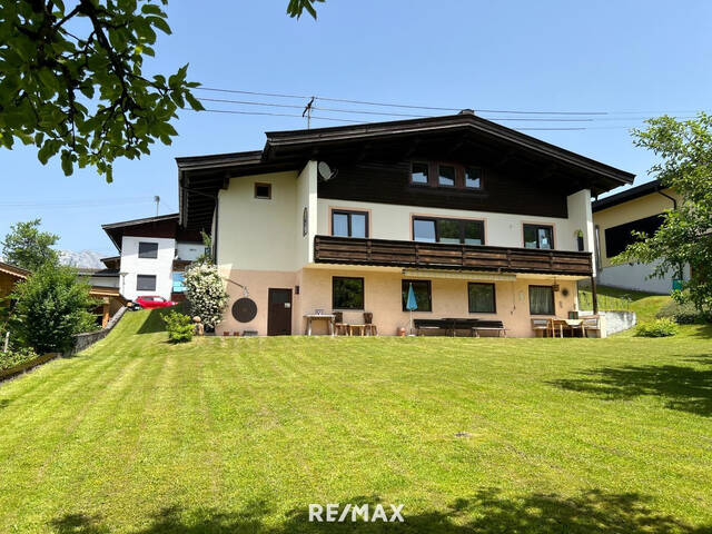 Immobilie in Hochfilzen - Traumgrundstück mit teilsaniertem Bestand in einzigartiger Aussichtslage auf Fieberbrunn - Bild 1