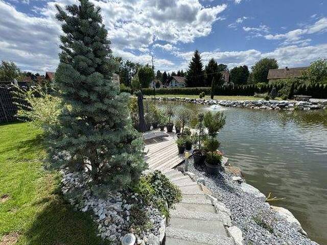 Immobilie in Unterpremstätten - Exklusive 3,5-Zimmer-Gartenwohnung mit direktem Naturteich-Zugang und Süd-West-Loggia in Unterpremstätten bei Graz - Bild 1