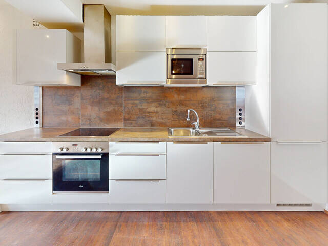 Immobilie in Seefeld in Tirol - Exklusive Wohnung über dem Dorfplatz Seefeld mit Südbalkon & Tiefgarage - Bild 1