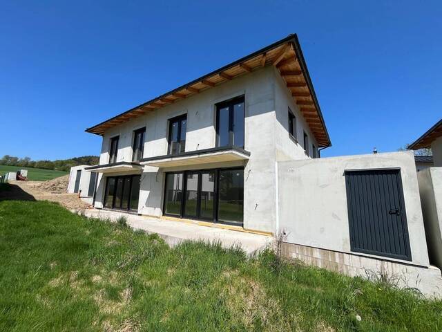 Immobilie in Bruckmühl - Attraktive belagsfertige Neubau – Doppelhaushälften mit Garage und sonnigem Garten zum Selbstausbau in Bruckmühl (H5/1, H5/2) - Bild 1