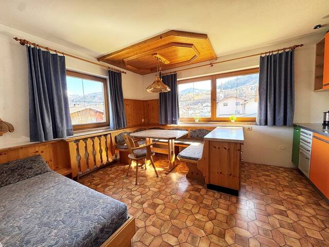 Immobilie in Kolsass - Sonnige Haushälfte mit Potential zum Ausbau und wunderschönen Garten - Bild 1