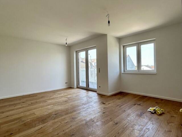 Immobilie in Mannswörth - Modernes Wohnen in Mannswörth - Erstbezug mit Balkon und hochwertiger Ausstattung - Bild 2