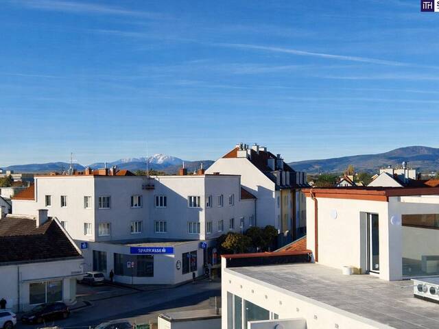 Immobilie in Traiskirchen - *Frühjahrsaktion* Premium-Wohnen über den Dächern: Stilvolle Neubauwohnung mit Masterbedroom, Ankleide, Bad mit Fenster und großer Dachterrasse! - Bild 2