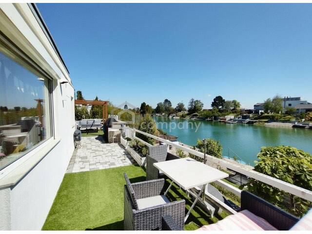 Immobilie in Groß-Enzersdorf - Seeliegenschaft leistbar gemacht: Haus am Wasser mit Traumterrasse u0026 eigenem Steg - Bild 0