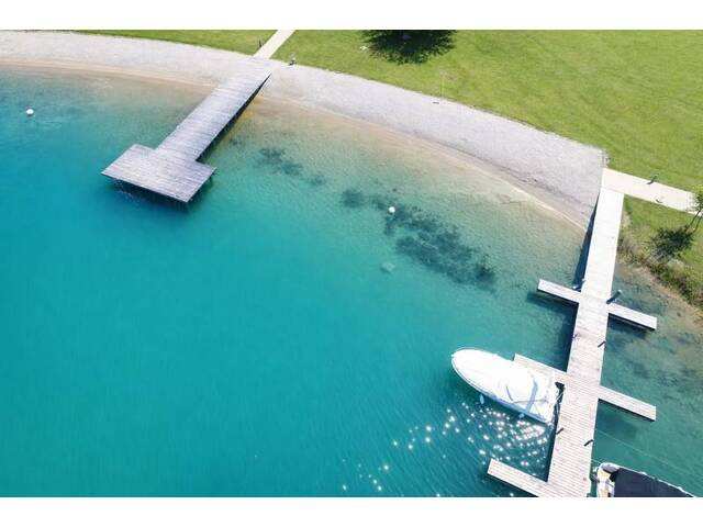 Immobilie in Faak am See - Exklusives Seepenthouse mit weitläufiger Liegewiese, direktem Seezugang und eigenem Bootsanlegeplatz - Bild 1
