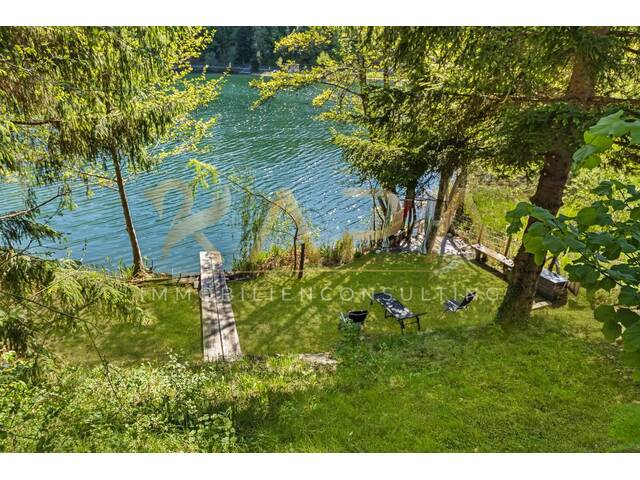 Immobilie in Unteraichwald - Eleganz trifft Natur – Top 1 am Aichwaldsee mit privatem Seezugang, Garten und Parkplatz! - Bild 1