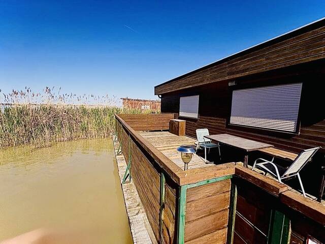 Immobilie in Rust - PRIVATSPHÄRE und FLIESSWASSER - FLACHDACHHÜTTE IN DER RUSTER BUCHT AUF PACHTGRUND ZU KAUFEN - Bild 1