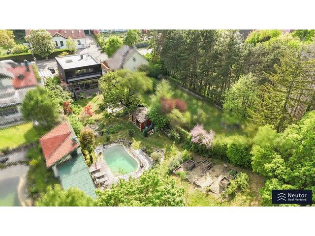 Immobilie in Pfaffstätten - EINZIGARTIGES EINFAMILIENHAUS MIT GROSSEM GARTEN -NATURPOOL - LUFTWÄRME PUMPE - GRÜNBLICK - Bild 0