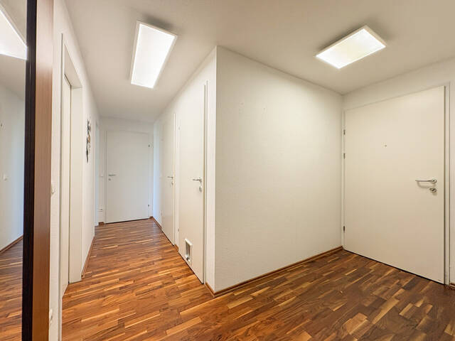 Immobilie in Lochau - Charmante 4-Zimmer-Wohnung mit Loggia, Terrasse, Garten und Tiefgaragenstellpatz in Lochau am Bodensee - Bild 1
