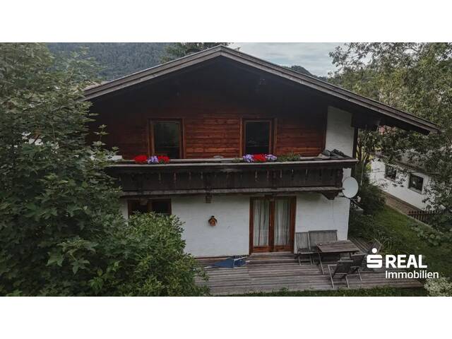 Immobilie in Vils - Solides Zweifamilienhaus mit großzügigem Grundstück und Entwicklungspotenzial in ruhiger Wohnlage von Vils - Bild 1