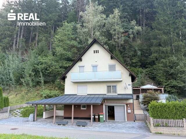 Immobilie in St. Michael in Obersteiermark - Einfamilienhaus mit Terrassenzubau, Flugdach und Carport in ruhiger Randlage von St. Michael in Obersteiermark - Bild 1