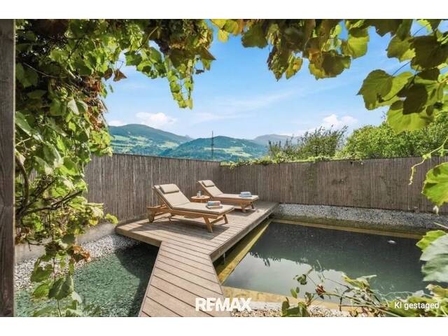 Immobilie in Baumkirchen - Wohnen im Grünen - Einfamilienhaus mit Naturpool & Wintergarten - Bild 1