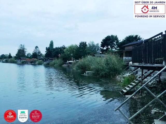 Immobilie in Gänserndorf - TRAUMHAFTES HAUS AM BADESEE BEI GÄNSERNDORF – EIGENER RÜCKZUGSORT AM WASSER - Bild 1